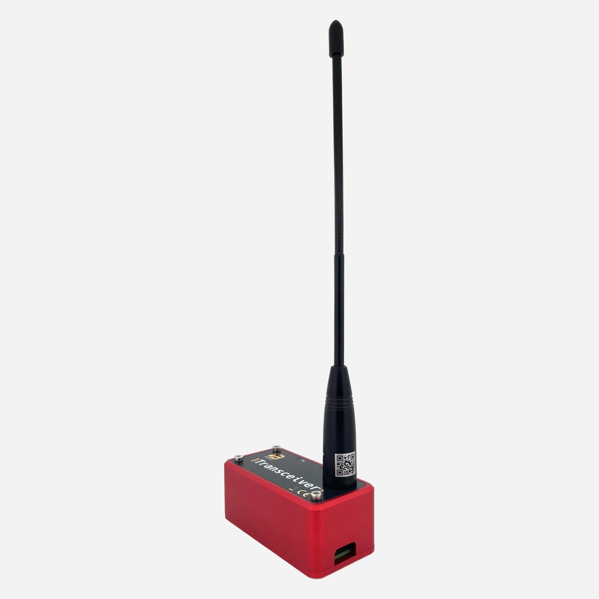 A compact device housed in a red aluminium enclosure, featuring a UHF antenna, designed to function as an EchoLink/SVXLink analog transceiver.