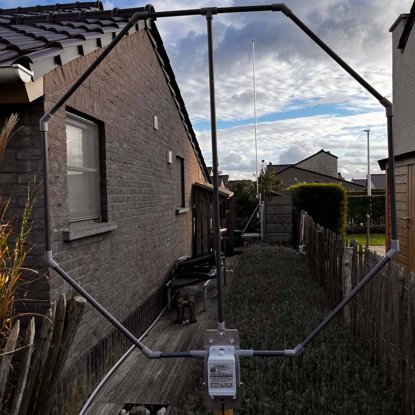 OctaLoop antenna installed outdoors in a garden, showcasing its compact design for low-noise reception in real-world environments.