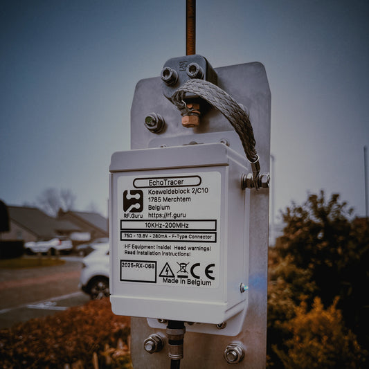 Side view of the EchoTracer outdoor module mounted on an RVS plate, showing the brass whip from a different angle.